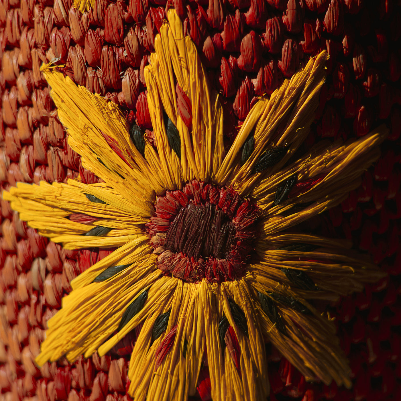 <p>in raffia</p>